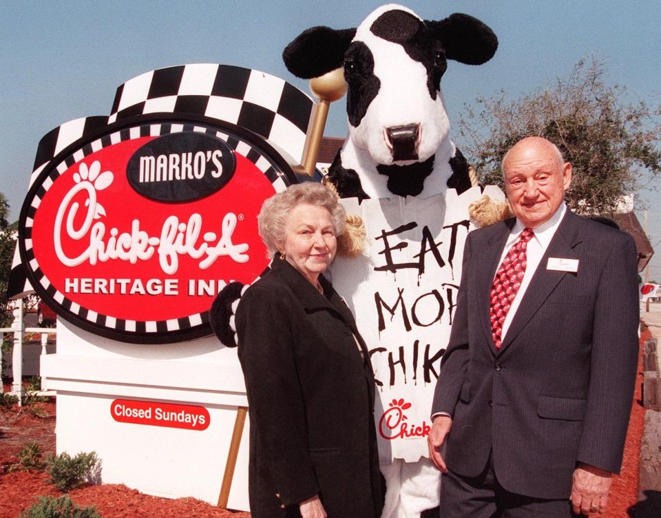 Chick-fil-A founder S. Truett Cathy, right, and his wife Jeannette Truett stand outside of the new restaurant Marko's Chick-fil-A Heritage Inn after opening ceremonies in Port Orange on Friday, February 4, 2000.