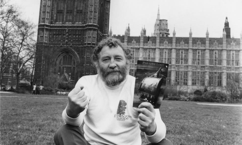 David Bellamy sitting in Parliament Square in 1981 with a copy of Paradise Lost?, the Friends of the Earth report on the widespread destruction of British wildlife.