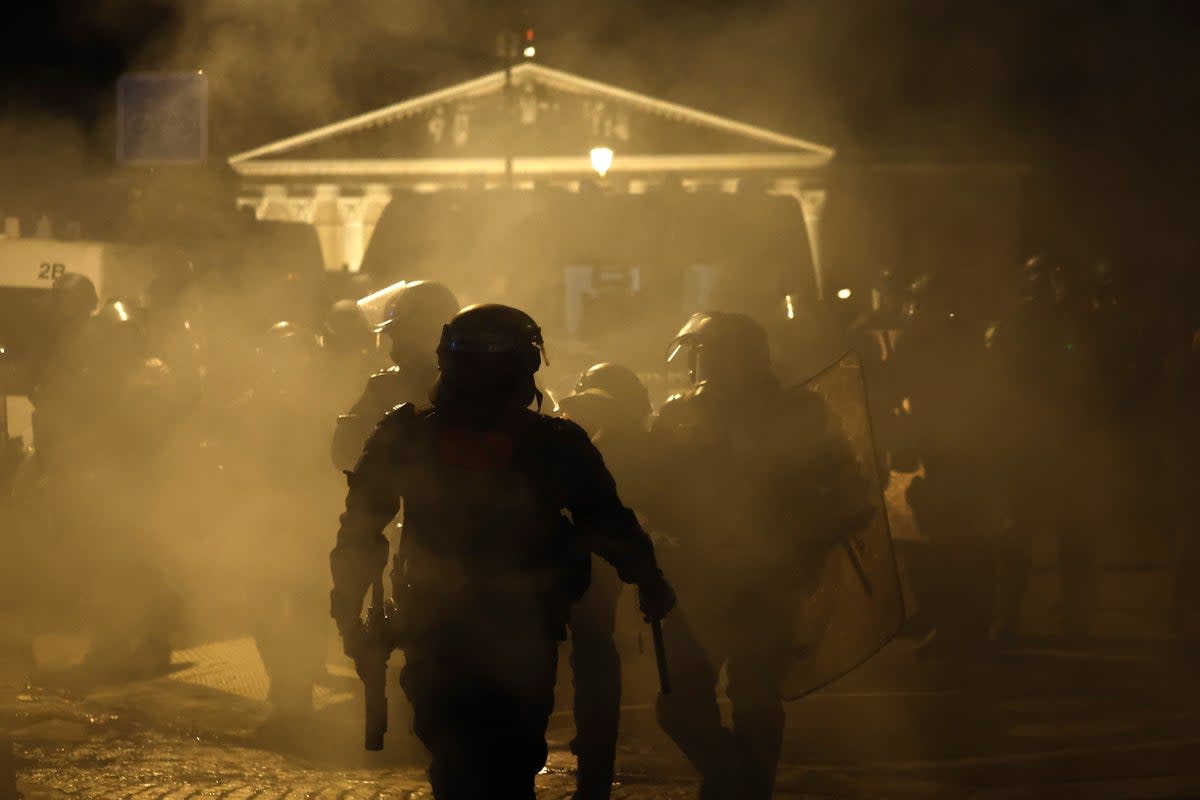 French police face protesters in the capital (EPA)