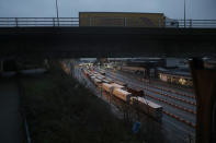 FILE - In this Saturday, Feb. 1, 2020 file photo, lorries wait to board ferries on the morning after Brexit took place at the Port of Dover in Dover, England. The British government says there could be lines of 7,000 trucks at the English Channel and two-day waits to get into France immediately after the U.K. makes its economic break from the European Union at the end of the year. (AP Photo/Matt Dunham, File)