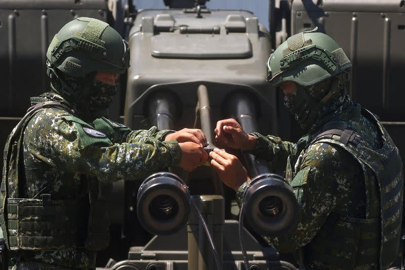 Soldiers demonstrate a GDF-006 anti-aircraft gun to the media in Hualien