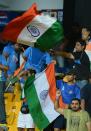 Indian cricket fans celebrate their team's victory over Pakistan in the World Twenty20 at the R. Premadasa International Cricket Stadium in Colombo on September 30, 2012