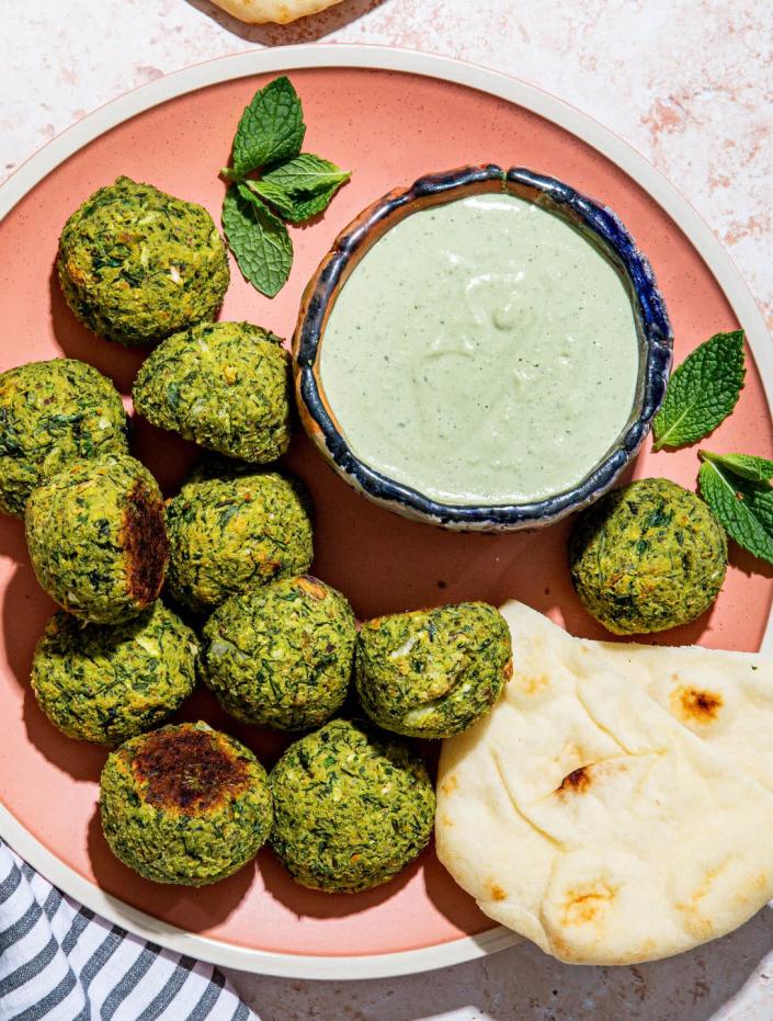 <p>Pistachios, mint, cilantro, dill, <em>and </em>parsley combine to turn these a lovely shade of green. Bonus: these these <a href="https://www.delish.com/cooking/recipe-ideas/recipes/a54231/easy-homemade-falafel-recipe/" rel="nofollow noopener" target="_blank" data-ylk="slk:falafel" class="link ">falafel</a> are baked, not fried, for less mess.</p><p>Get the <strong><a href="https://www.delish.com/cooking/recipe-ideas/a37048772/baked-falafel-recipe/" rel="nofollow noopener" target="_blank" data-ylk="slk:Herby Baked Falafel Bites with Spicy Mint Tahini Dip recipe" class="link ">Herby Baked Falafel Bites with Spicy Mint Tahini Dip recipe</a>.</strong></p>
