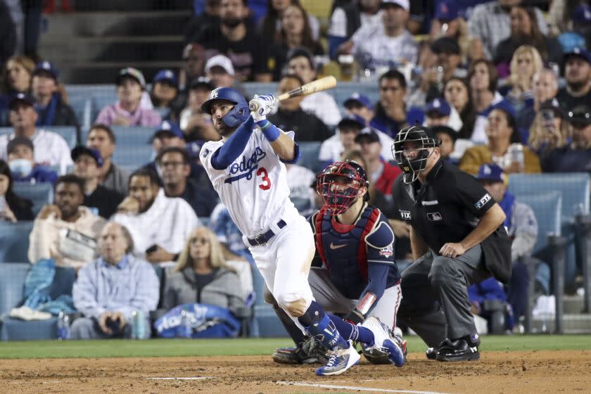 Dodgers' Chris Taylor follows through on a swing for a two-run home run