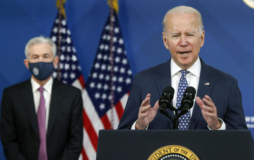 President Biden speaks as Federal Reserve Board Chair Jerome Powell listens.