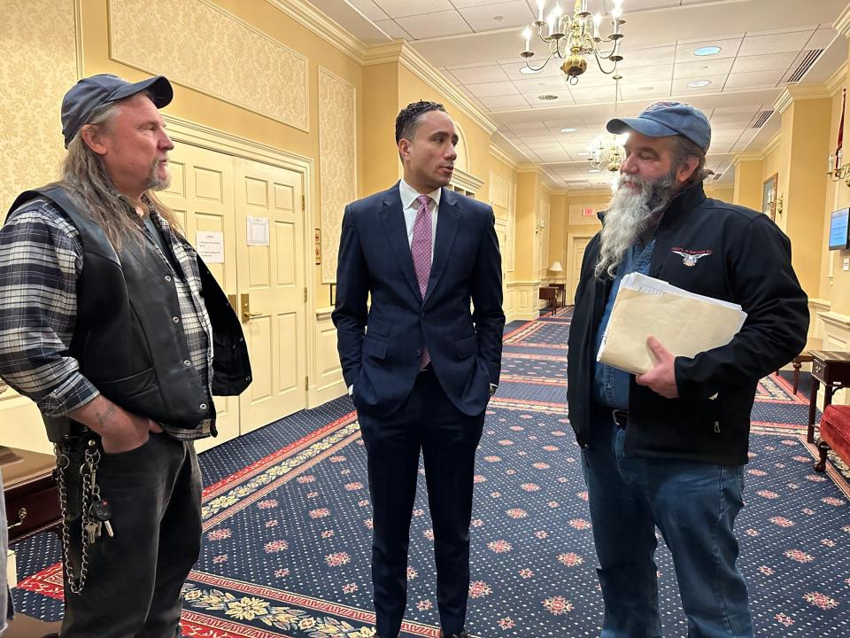 ABATE leaders Bob Spanburgh, left, and Ken Eaton, right, lobby Senate Judicial Proceedings Chairman Will Smith, D-Montgomery County, on Feb. 12, 2024, to support a law that would exempt most motorcyclists from wearing helmets.