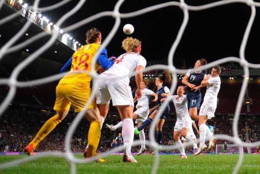 United States forward Alex Morgan (4th R) heads the winning goal during the London 2012 Olympic Games womens semi final football match between USA and Canada at Old Trafford in Manchester. The United States advanced to the final of the Olympic women's football tournament on Monday after the goal in the last minute of extra-time clinched a dramatic 4-3 victory over Canada