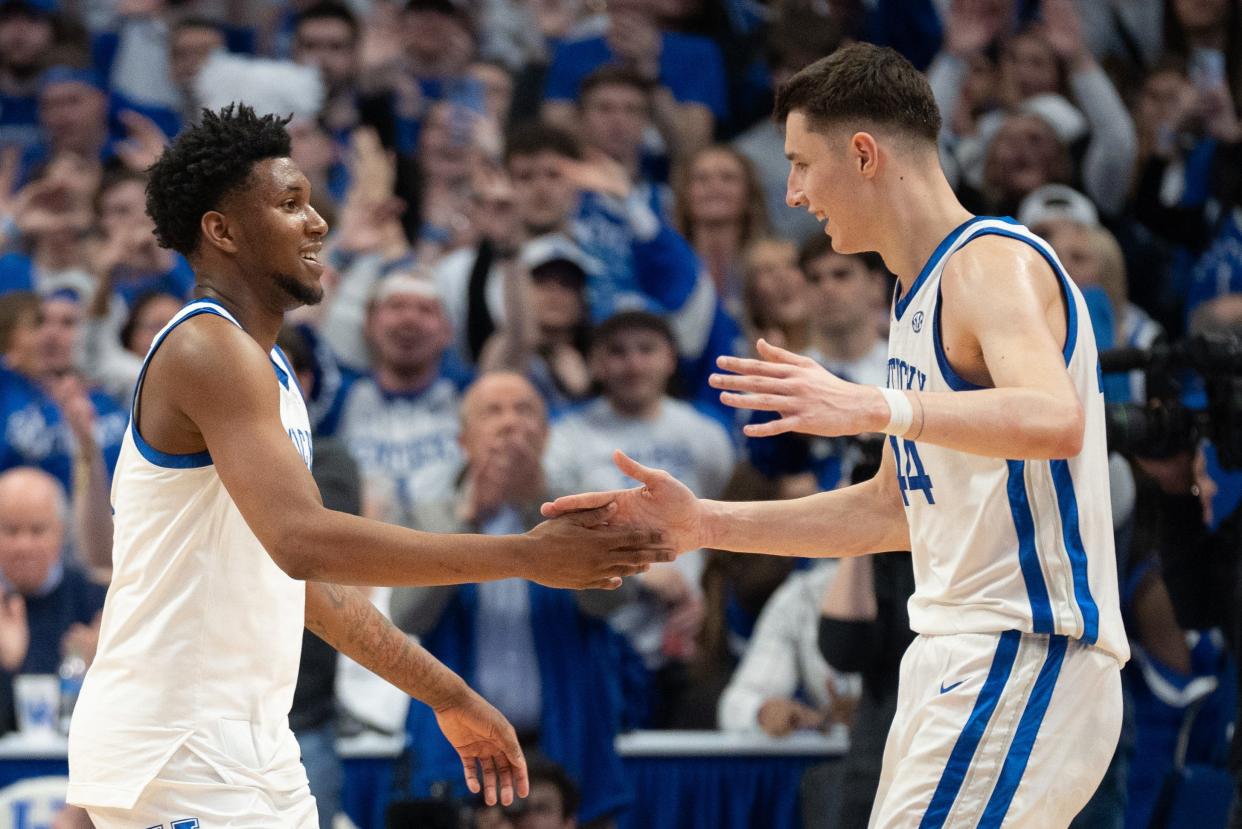 Kentucky Wildcats forward Zvonimir Ivisic (44) and guard Adou Thiero (3) celebrate their 111-102 win over Arkansas Razorbacks on Saturday, March 2, 2024 at Rupp Arena.