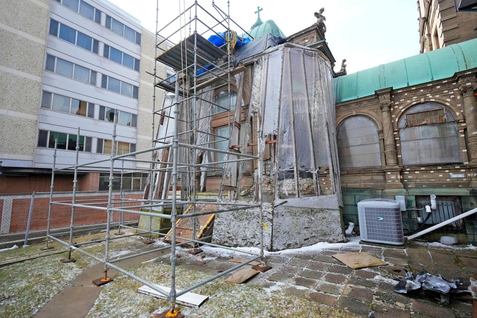 Support beams brace a crumbling Cream City brick exterior at the Pabst Mansion's pavilion.