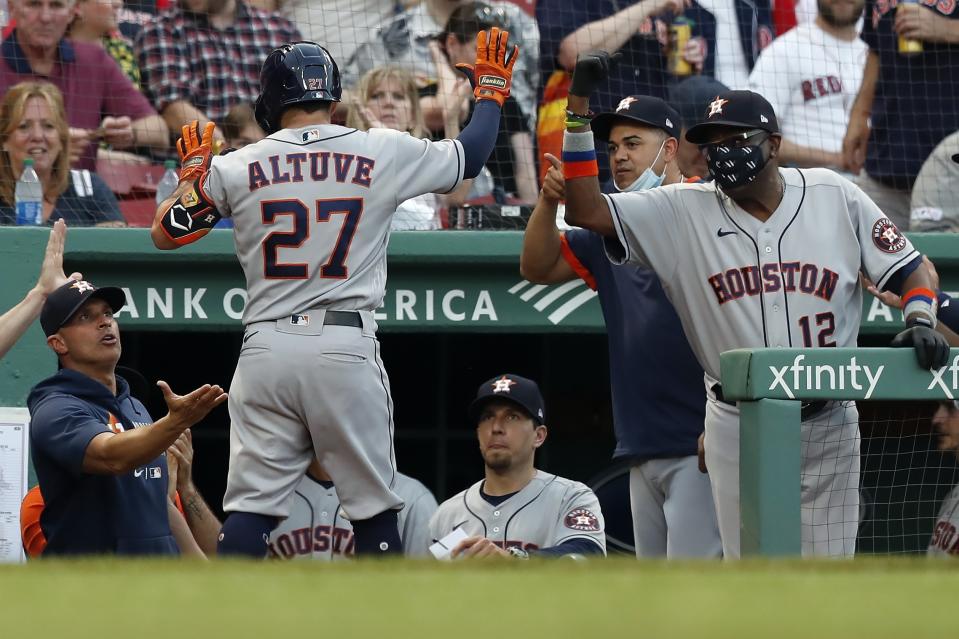 Houston Astros' Jose Altuve (27) celebrates his solo home run during the third inning of a baseball game against the Boston Red Sox, Wednesday, June 9, 2021, in Boston. (AP Photo/Michael Dwyer)