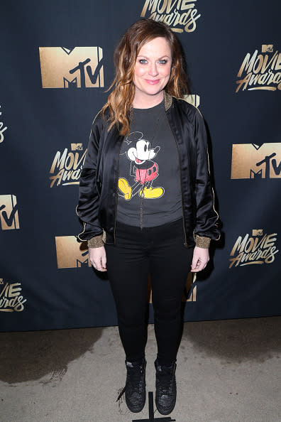 Amy Poehler in a Mickey Mouse T-shirt and silk bomber jacket 