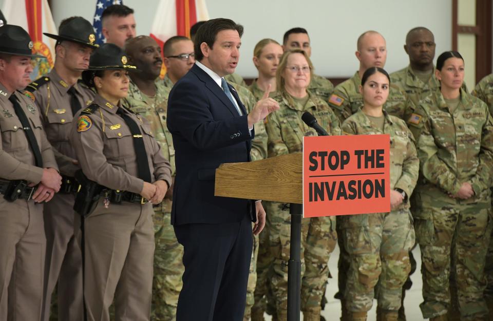 Gov. Ron DeSantis addresses the audience backed by members of the Florida Highway Patrol, the Florida National Guard and the Florida State Guard during a Feb. 1 news conference at Cecil Commerce Center on Jacksonville's Westside. There he announced plans to deploy members of the Florida National Guard and the Florida State Guard to the borders of Texas and other areas to help slow down the tide of individuals entering the United States illegally.