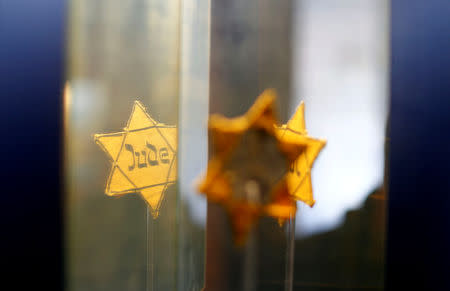 A yellow badge is pictured in a museum at the former synagogue in Halberstadt, Germany, May 4, 2019. Picture taken May 4, 2019. REUTERS/Fabrizio Bensch