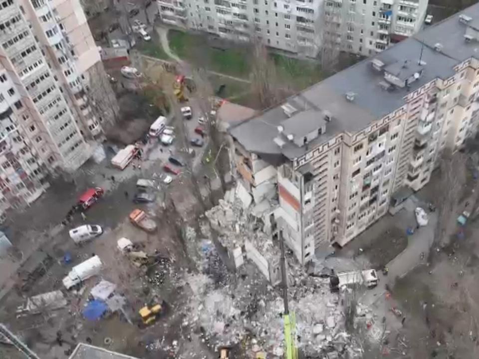 Drone view shows rescue crews working at the site of a residential building heavily damaged by a Russian drone strike that killed several residents in Odesa earlier this week (via REUTERS)