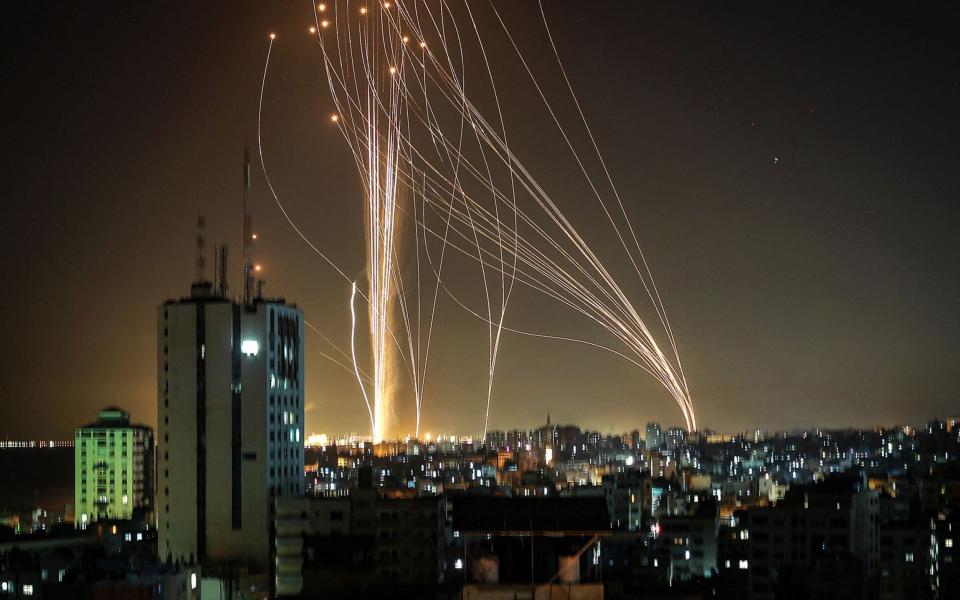 Rockets are launched from Gaza city, controlled by the Palestinian Hamas movement, in response to an Israeli air strike on a 12-storey building in the city, towards the coastal city of Tel Aviv - AFP