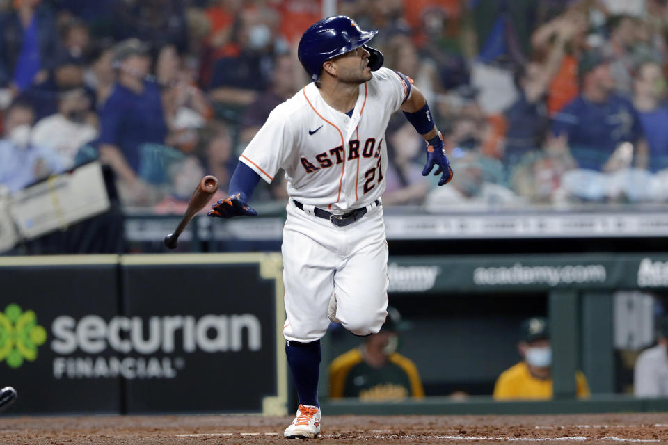 Houston Astros' Jose Altuve flips his bat as he watches his home run during the seventh inning of the team's baseball game against the Oakland Athletics on Thursday, April 8, 2021, in Houston. (AP Photo/Michael Wyke)
