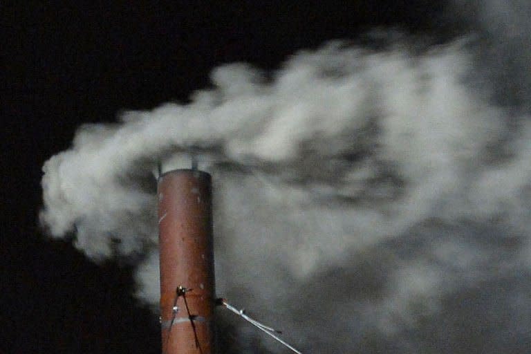 White smoke rises from the chimney on the roof of the Sistine Chapel meaning that cardinals elected a new pope on the second day of their secret conclave on March 13, 2013 at the Vatican