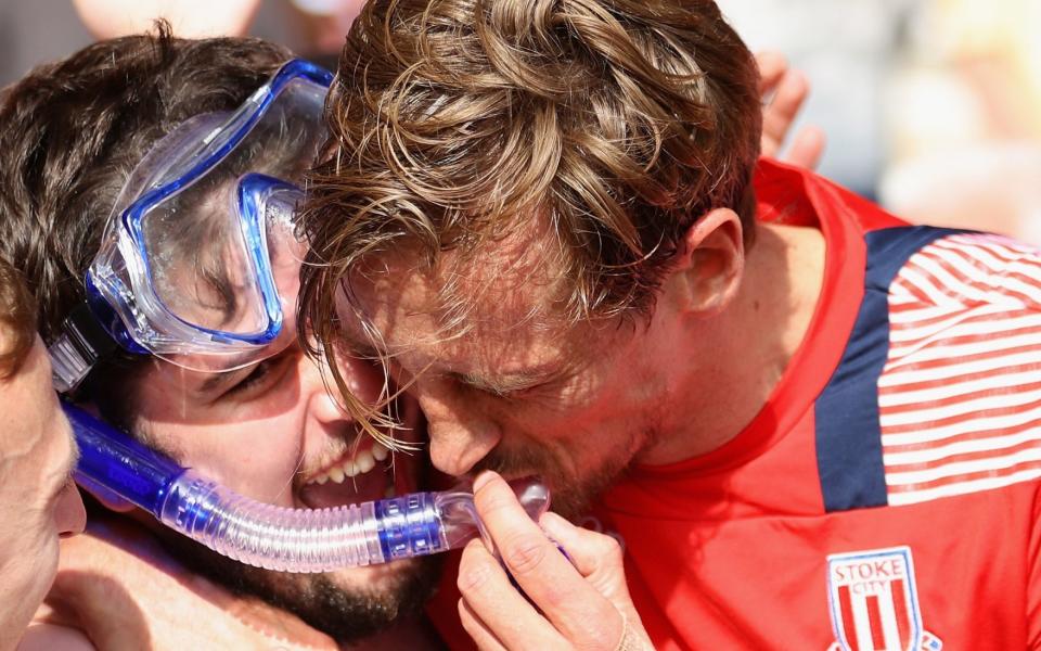 Peter Crouch celebrates with a Stoke fan who turned up in Speedos  - Getty Images Europe