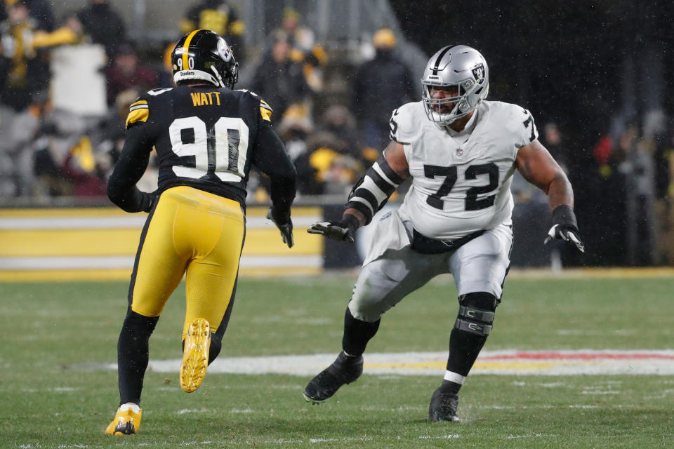 Dec 24, 2022; Pittsburgh, Pennsylvania; Las Vegas Raiders guard Jermaine Eluemunor (72) prepares to block at the line of scrimmage against Pittsburgh Steelers linebacker T.J. Watt (90) during the first quarter at Acrisure Stadium. Charles LeClaire-USA TODAY Sports