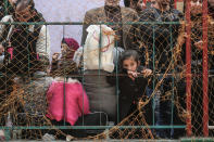 <p>Gazaians wait for a bus, which will transport them to Egypt, after Egyptian authorities decision on opening the Rafah border gate, located between besieged Gaza and Egypt, bidirectional for three days in Khan Yunis, Gaza on Feb. 8, 2018. (Photo: Ali Jadallah/Anadolu Agency/Getty Images) </p>