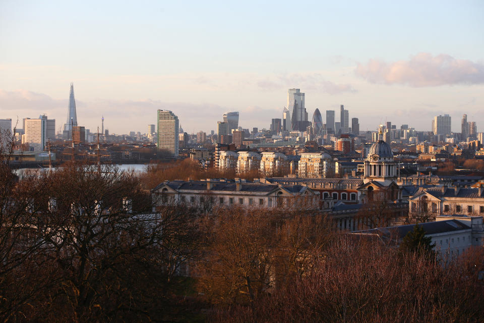 LONDON, ENGLAND - DECEMBER 27: A view of The Shard skyscraper and City of London skyline from the top of Greenwich Park on December 27, 2020 in London, United Kingdom. Last week, the British government scrapped a plan to allow household mixing in England for five days over Christmas. In London and southeast, household mixing was banned, and in other parts of the country indoor meetups were confined to Christmas Day.  (Photo by Hollie Adams/Getty Images)