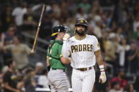 San Diego Padres' Fernando Tatis Jr. flips his bat after hitting a two-run home run against the Oakland Athletics during the third inning of a baseball game Tuesday, July 27, 2021, in San Diego. (AP Photo/Derrick Tuskan)