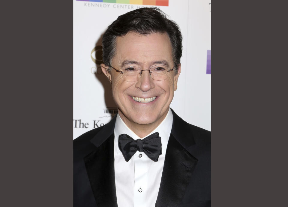 FILE - In this Dec. 6, 2015 file photo, Stephen Colbert attends the 38th Annual Kennedy Center Honors at The Kennedy Center Hall of States in Washington. Colbert will host the annual Emmy Awards telecast, this year to be shown on his home network of CBS on Sept. 17 in Los Angeles. (Photo by Greg Allen/Invision/AP, File)