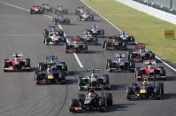 Lotus Formula One driver Romain Grosjean of France leads during the Japanese F1 Grand Prix at the Suzuka circuit October 13, 2013. REUTERS/Issei Kato (JAPAN - Tags: SPORT MOTORSPORT F1)