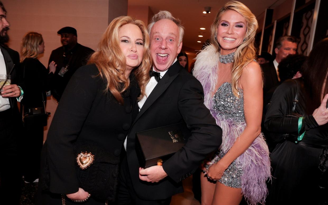 White Lotus star Jennifer Coolidge with creator Mike White and Heidi Klum at the Golden Globes - Getty
