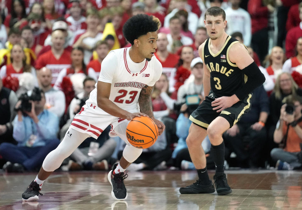 Feb 4, 2024; Madison, Wisconsin, USA; Wisconsin Badgers guard Chucky Hepburn (23) dribbles the ball against Purdue Boilermakers guard Braden Smith (3) during the first half at the Kohl Center. Mandatory Credit: Kayla Wolf-USA TODAY Sports