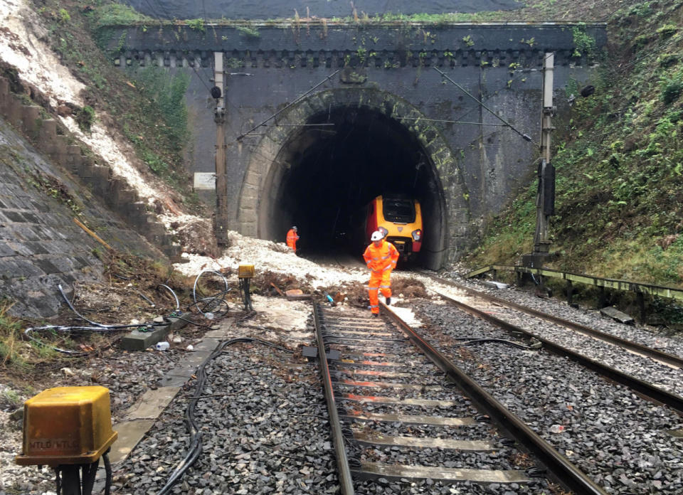 Workers try to repair the track near Watford, which caused huge delays (SWNS)