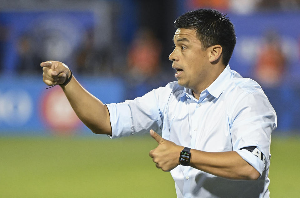 Atlanta United head coach Gonzalo Pineda gives instruction from the sideline during second-half MLS soccer match action against CF Montreal in Montreal, Saturday, July 8, 2023. (Graham Hughes/The Canadian Press via AP)