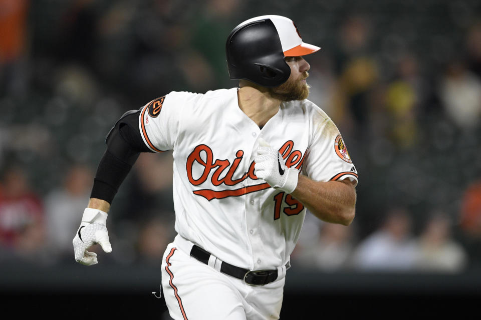 Baltimore Orioles' Chris Davis runs toward first as he lined out during the fifth inning of a baseball game against the Oakland Athletics, Monday, April 8, 2019, in Baltimore. (AP Photo/Nick Wass)