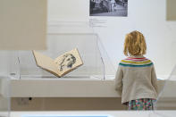 A girl observes part of the Picasso: 14 Sketchbooks exhibit at Pace Gallery in New York, Thursday, Nov. 9, 2023. (AP Photo/Peter K. Afriyie)