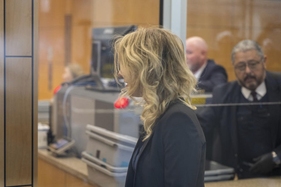 Theranos founder and CEO Elizabeth Holmes arrives to federal court in San Jose, Calif., Friday, Nov. 18, 2022. A federal judge will decide whether Holmes should serve a lengthy prison sentence for duping investors and endangering patients while peddling a bogus blood-testing technology. (AP Photo/Nic Coury)