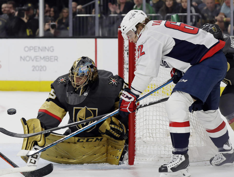 Washington Capitals forward Carl Hagelin shoots as Vegas Golden Knights goalie Marc-Andre Fleury defends during the first period of an NHL hockey game Monday, Feb. 17, 2020, in Las Vegas. (AP Photo/Isaac Brekken)