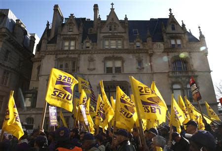 Members of the Service Employees International Union (SEIU) march during a protest in support of a new contract for apartment building workers in New York City, April 2, 2014. REUTERS/Mike Segar