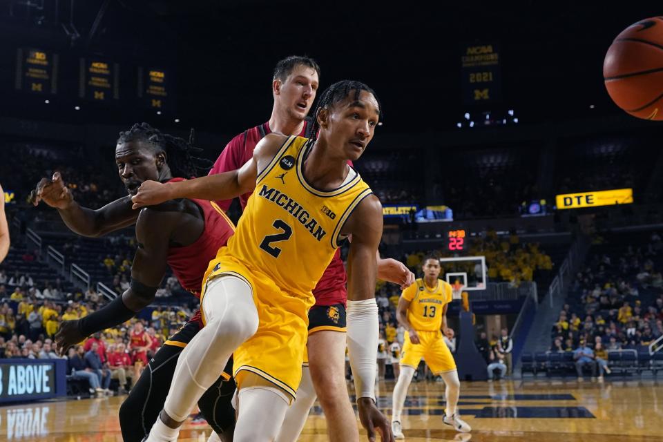 Ferris State guard Amari Le, left, Michigan guard Kobe Bufkin (2) and Ferris State center Vejas Grazulis (3), rear, look at the loose ball during the first half of an exhibition game at Crisler Center in Ann Arbor on Friday, Nov. 4, 2022.