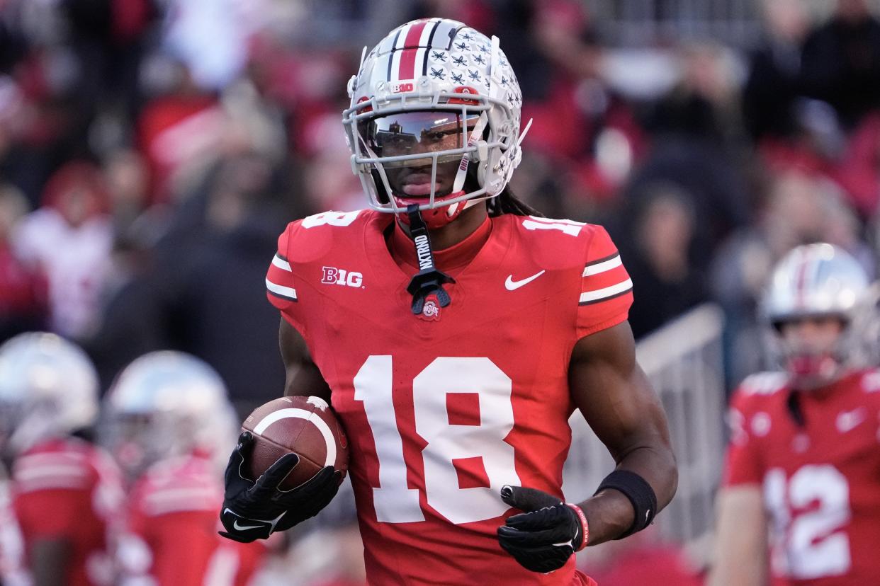 Nov 18, 2023; Columbus, Ohio, USA; Ohio State Buckeyes wide receiver Marvin Harrison Jr. (18) warms up prior to the NCAA football game against the Minnesota Golden Gophers at Ohio Stadium.