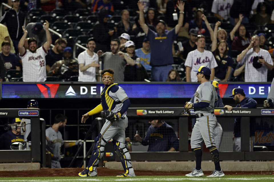 Milwaukee Brewers catcher William Contreras, front left, reacts after New York Mets designated hitter Daniel Vogelbach (not shown) fouled for the final out during the ninth inning of a baseball game, Monday, June 26, 2023, in New York. (AP Photo/Adam Hunger)