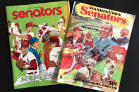 Washington Senators programs, including one featuring Richard Nixon and Ted Williams, right, are shown in New York, Tuesday, Oct. 15, 2019. Growing up in the Washington suburbs during the 1960s, the local baseball team was a lost cause. A trip to the World Series like these Nationals? Forget it. (AP Photo/Ben Walker)
