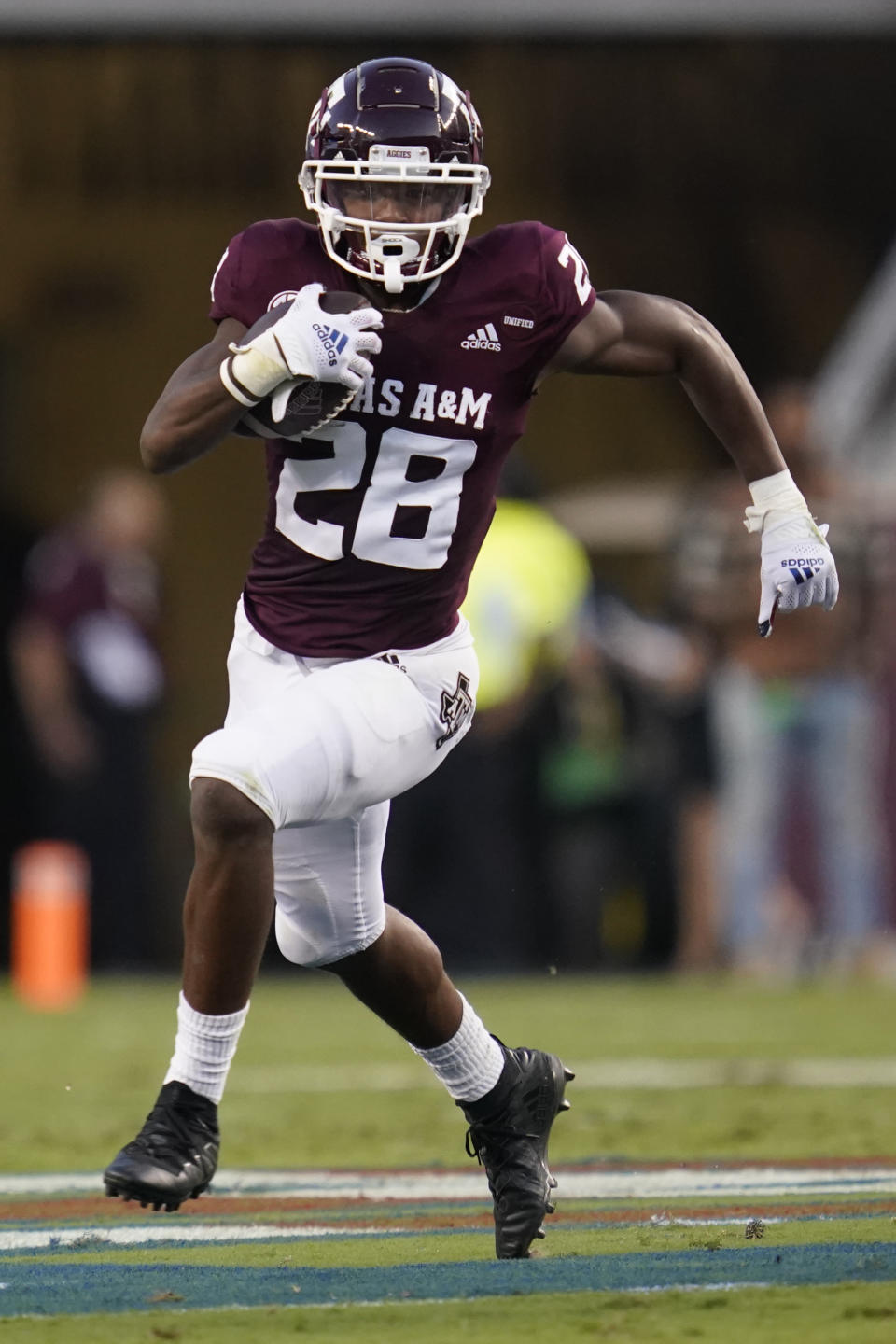 Texas A&M running back Isaiah Spiller (28) breaks to the outside against Kent State for a first down run during the first quarter of an NCAA college football game on Saturday, Sept. 4, 2021, in College Station, Texas. (AP Photo/Sam Craft)