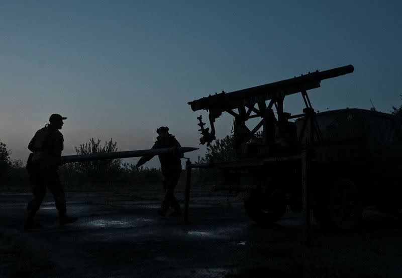 Members of company tactical group "Steppe Wolves" prepare a handmade small MLRS for firing toward Russian troops in Zaporizhzhia region