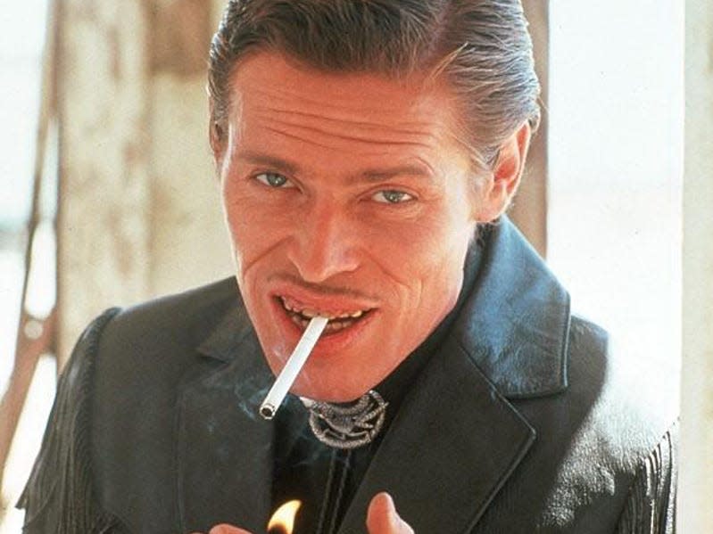 Willem Dafoe smoking a cigarette