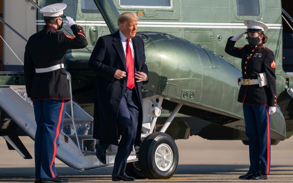 Donald Trump disembarking Marine One on Tuesday - AP