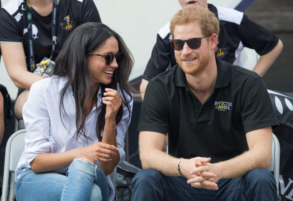 Meghan Markle stepped out for one of her first official appearances with Prince Harry in the now-iconic Misha Noonoo Husband shirt.