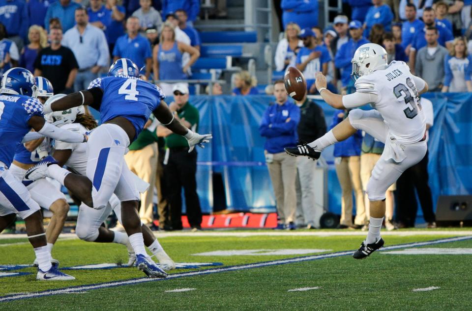 Kentucky linebacker Joshua Paschal blocks a punt by Eastern Michigan punter Jake Julien which turned the ball over to Kentucky leading to a touchdown during the second half of an NCAA college football game Saturday, Sept. 30, 2017, in Lexington, Ky. Kentucky won the game 24-20. (AP Photo/David Stephenson)