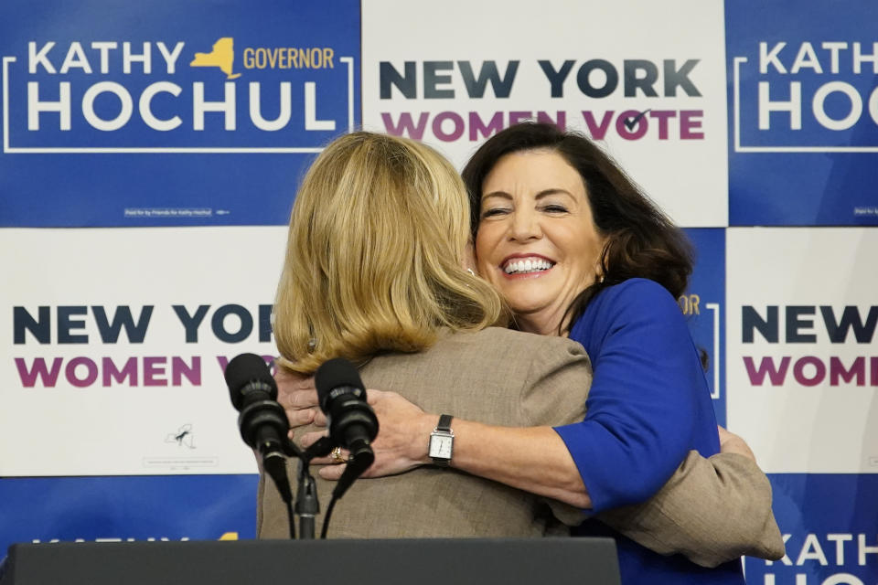 Former Secretary of State Hillary Clinton hugs New York Gov. Kathy Hochul, right, during a campaign event for Hochul, Thursday, Nov. 3, 2022, at Barnard College in New York. (AP Photo/Mary Altaffer)