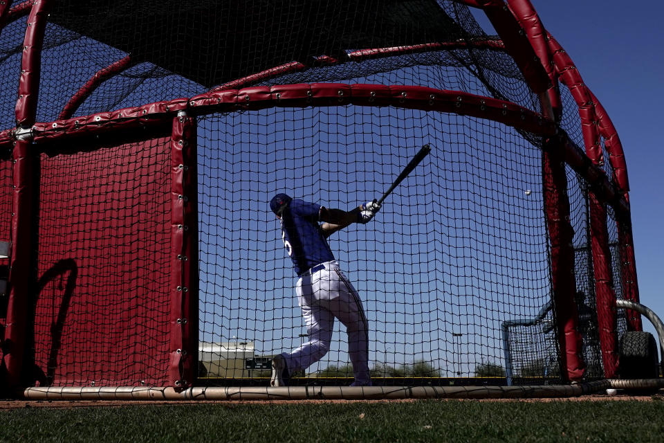 Texas Rangers' Corey Seager bats during spring training baseball practice Monday, Feb. 20, 2023, in Surprise, Ariz. (AP Photo/Charlie Riedel)