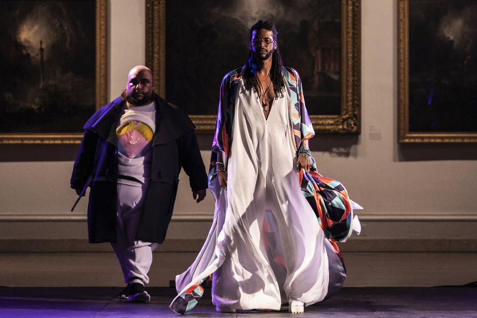The Travis Oestreich collection is modeled during the dapperQ fashion show at the Brooklyn Museum on Thursday, Sept. 5, 2019, in New York. (AP Photo/Jeenah Moon)